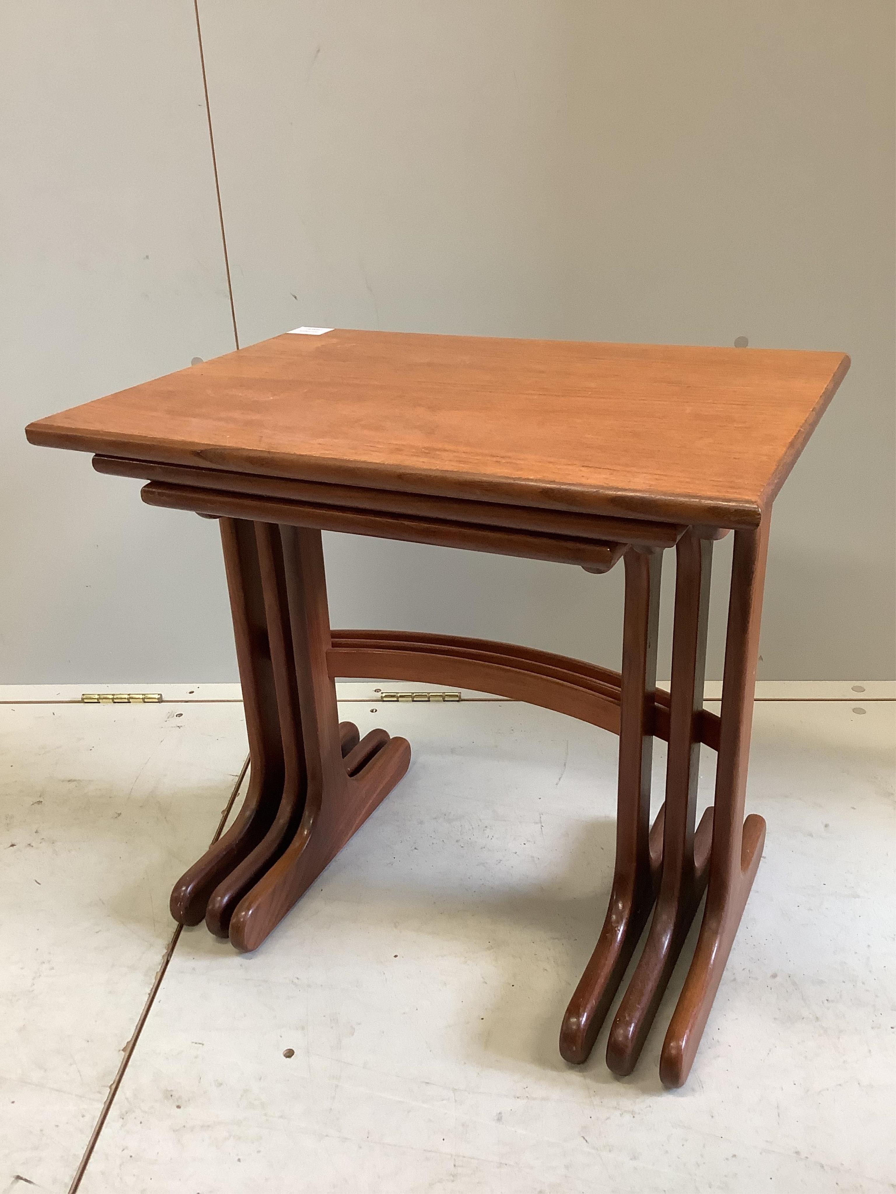 A nest of three G-Plan teak tables, width 56cm, depth 40cm, height 52cm. Condition - fair